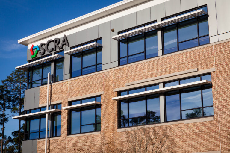 Exterior of the SCRA office building with brick and glass facade.