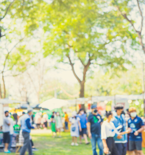 A crowd of people at an outdoor festival.