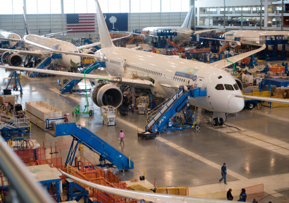 Four passenger airplanes sit in a hangar in the Charleston region.