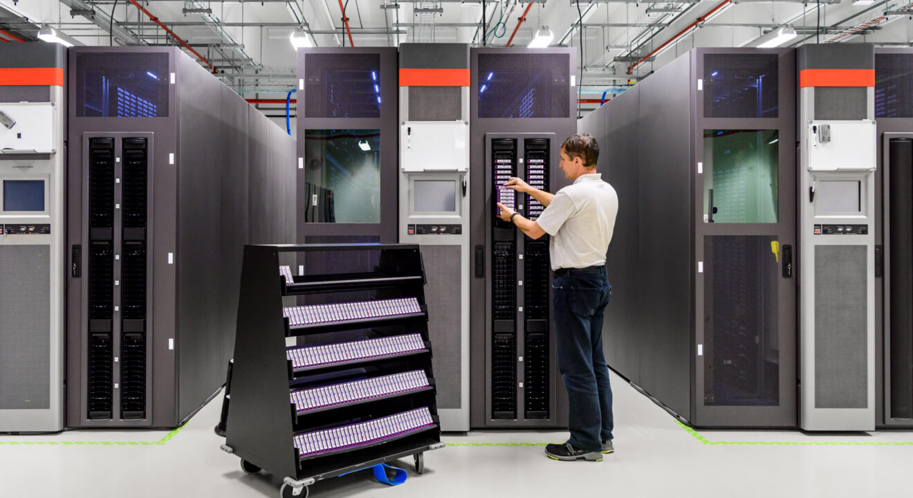 A man works in a data storage facility.