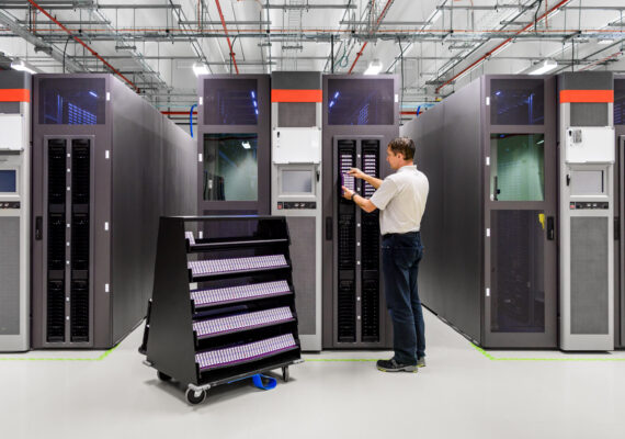 A man works in a data storage facility.