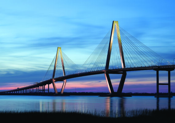 A wide shot of the Ravenel Jr. Bridge in South Carolina at dusk.