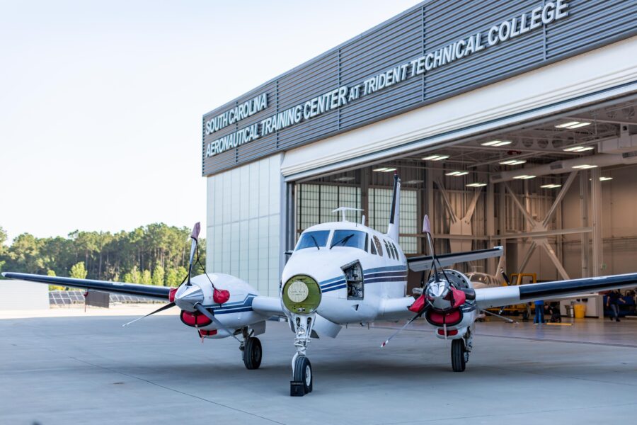 A small airplane sits in front of a hangar at the South Carolina Aeronautical Training Center at Trident Technical College.