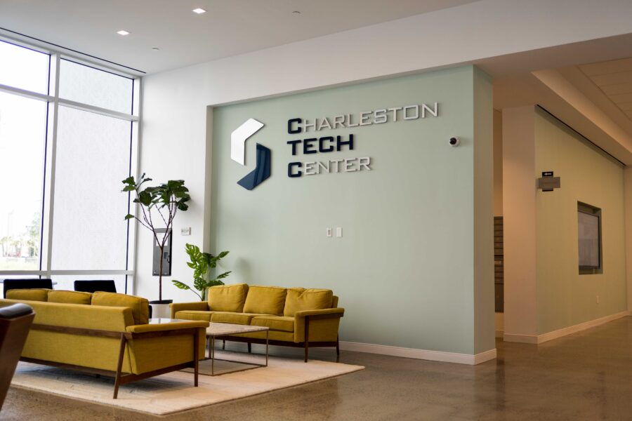 Couches, chairs and plants make up the interior of the lobby at the Charleston Tech Center.