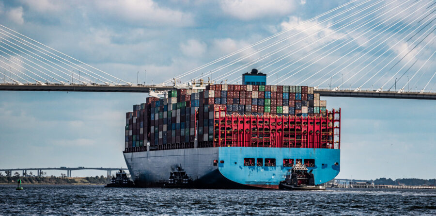 A freight ship gets ready to sail under the Cooper River Bridge in Charleston, SC.