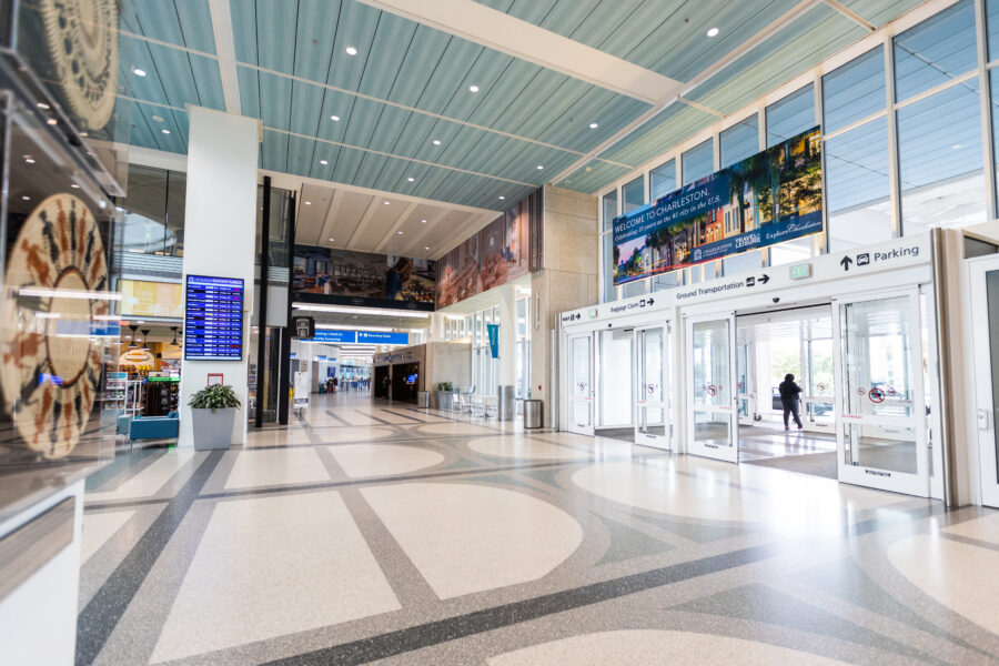 The interior of the Charleston International Airport lobby during the day.