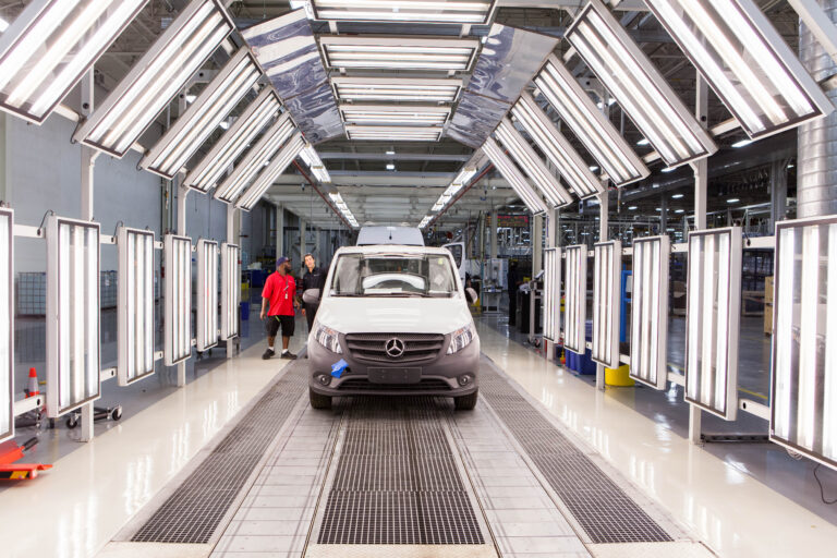 A Mercedez van in a manufacturing facility.